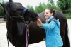 Daniela Hudribush, MMCP A woman working with a horse.