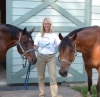 Diane Dzingle, MMCP A woman with 2 horses.