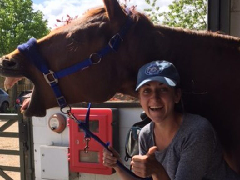 Student working with horse