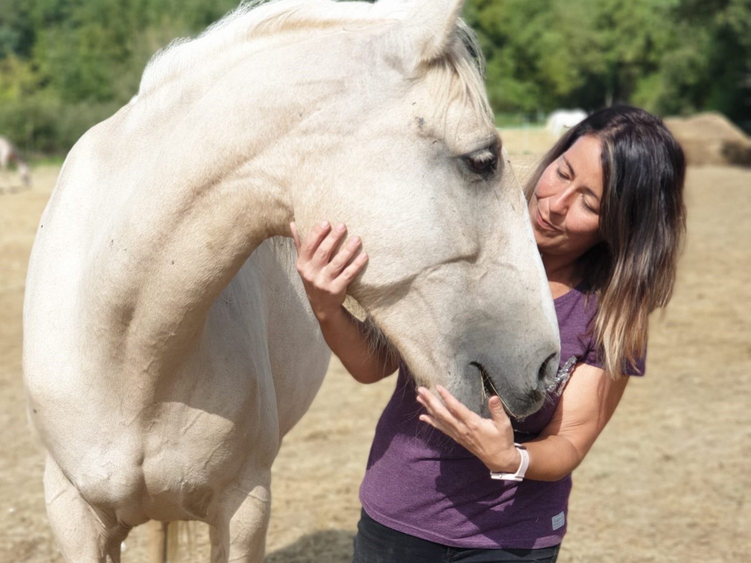 A woman working with a horse.
