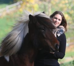 Nadine Lohmann MMCP A woman smiling with a horse.