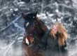 woman and horse in winter snow