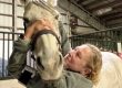 A woman working with a horse.