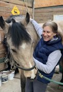 Linda DeBowes MMCP A woman working with a horse.