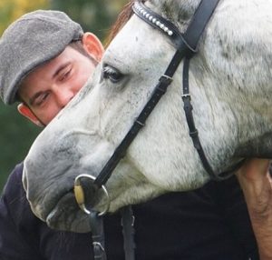 Photo of man and horse's head