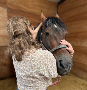 A woman working with a horse.