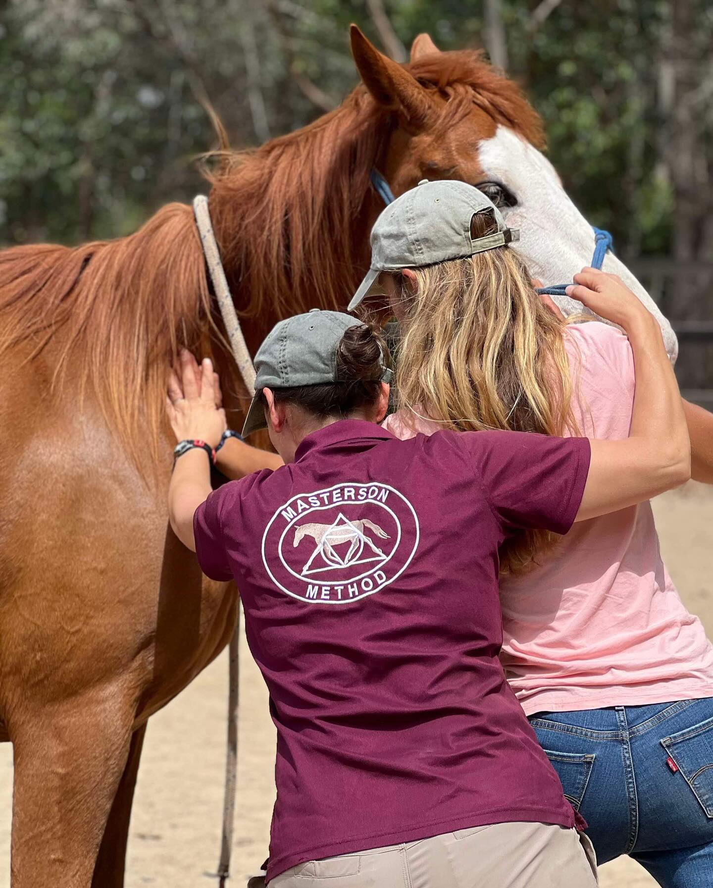 Instructor teaching a student how to do a Masterson Method technique with hands-on assistance.