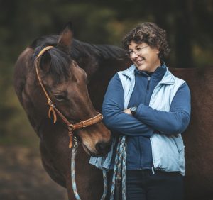 A woman and a horse.