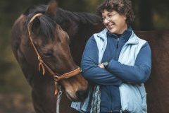 A woman and a horse.