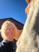 Patricia McKinney MMCP A woman smiling with a horse.