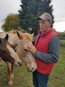 A man working with a horse.