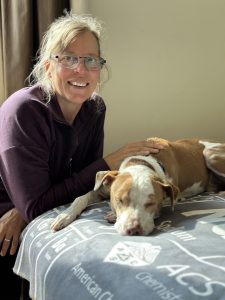 A woman working with a dog.
