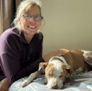 A woman working with a dog.