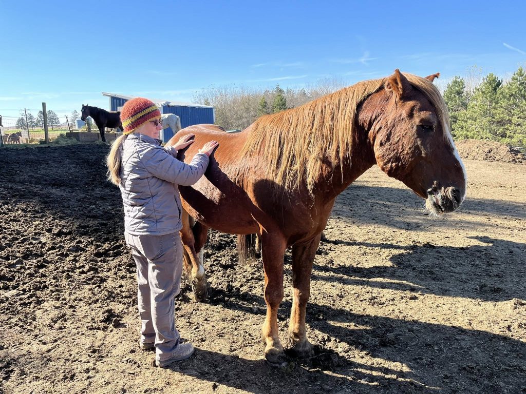 Photo of Megan Dushin releasing fascia on mustang at liberty.