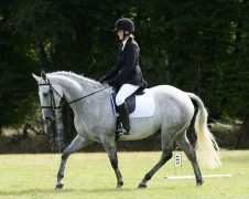 Rosalyn Bolt MMCP A woman riding a horse.
