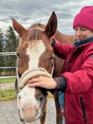 A woman working with a horse.