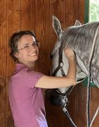 A woman working with a horse.