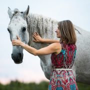 A woman working with her horse.