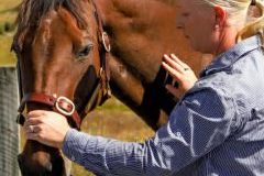 A woman working with a horse.