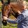 A woman working with a horse.