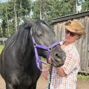 A woman working with a horse.