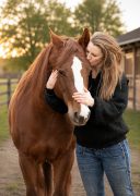 Miriam Drapela MMCP A woman standing with her horse.