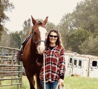 Kirstin Hadwiger MMES A woman standing with a horse.