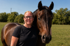 Melissa Reetz MMCP A woman standing with her horse.