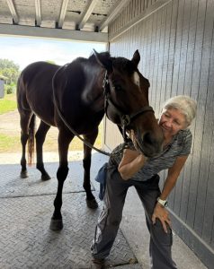 A woman working with a horse.