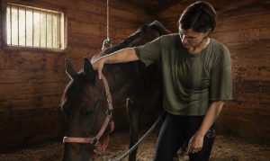 A woman working with a horse.