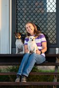karen whitfield MMCP Canine A woman smiling, with two dogs.